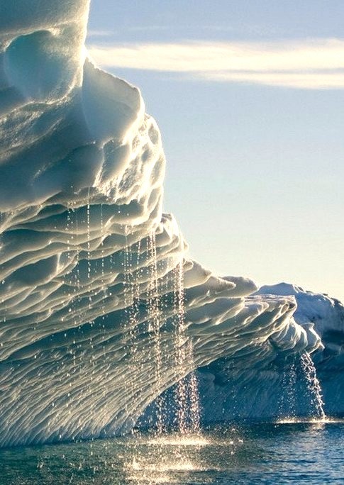 Melting water streams from iceberg in Disko Bay, Greenland